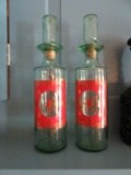 2 GREEN GLASS WITH RED AND GOLD DESIGN DECANTERS