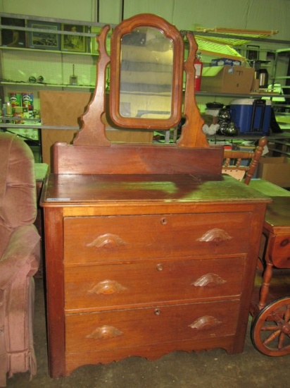 ANTIQUE DRESSER WITH LEAF PULLS. MARBLE INSERT HAS BEEN REPLACED WITH WOOD.