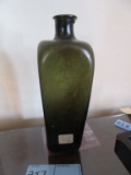 GREEN BOTTLE. TAG SAYS 1780 GIN BOTTLE.