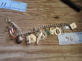 STERLING CHARM BRACELET WITH SOME STERLING CHARMS