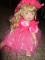 GIRL DOLL PINK DRESS 9470/15000 PORCELAIN FACE ARMS LEGS CLOTH BODY