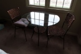 GLASS TOP TABLE WITH METAL FRAME AND 2 CHAIRS. DESIGN IS A WICKER TYPE MATE