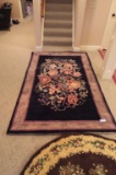FLORAL AREA RUG APPROXIMATELY 6 BY 9