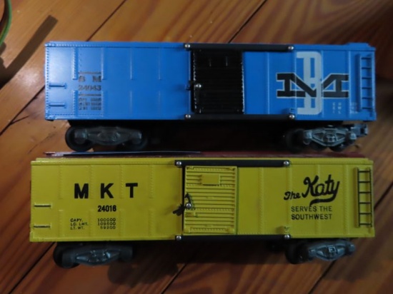 THE KATY BOX CAR NUMBER 24016 + B M BOX CAR NUMBER 24043. BOTH ARE MADE BY AMERICAN FLYER