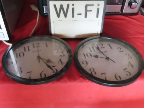 lot of two Sharp battery powered wall clocks and composite Wi-Fi password sign.