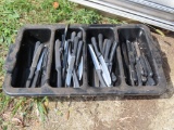 large amount of steak knives with plastic holder.