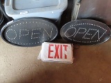 lot of two open signs and exit sign with exit sign parts.