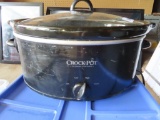 black crock pot with glass lid and insert. plastic is chipped on handle.