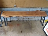 rough cut, rustic style wooden and metal bench. approximately 53-1/4 in Long by 13-1/2 in wide at