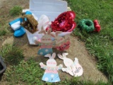 variety of holiday decorations with clear tote and lid.