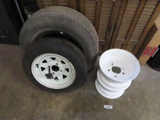 lot of trailer rims with one tire and 14 in rim with Goodyear Regatta Tire