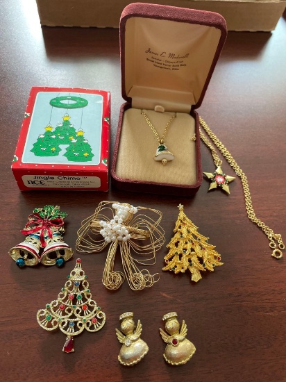 Assorted Christmas costume jewelry. Necklaces and brooches. Christmas wind chimes.