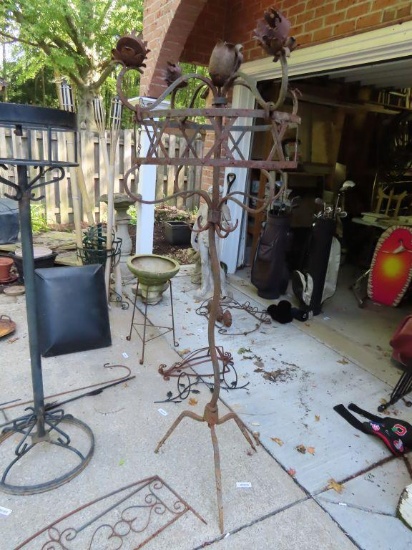 antique iron candle holder. approximately 6 ft tall