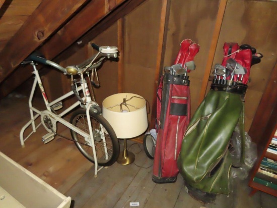 vintage Columbia exercise bike. vintage golf clubs and retro style lamp on third floor