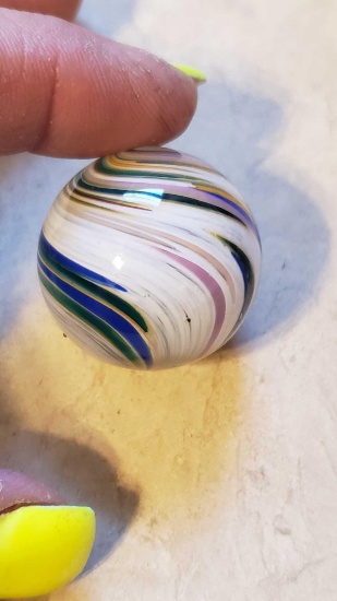 handmade white, pink, blue, and orange swirled marble approximately 1 in