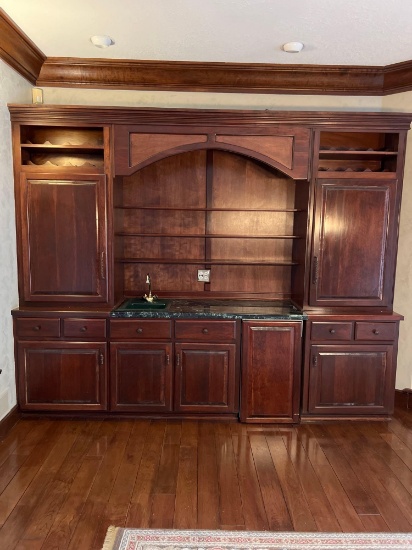 REDUCED OPENING BID! cherry wet bar with sink and mini refrigerator. 10' wide x 2' deep x 8' tall.