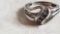 two small gemstones on triple band ring, has markings