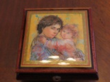 woman holding baby painting by Hibel on musical jewelry box made in Italy. Swiss made by reuge.