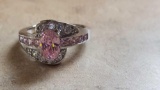 925 ring with smaller pink and clear gemstones surrounding center pink stone