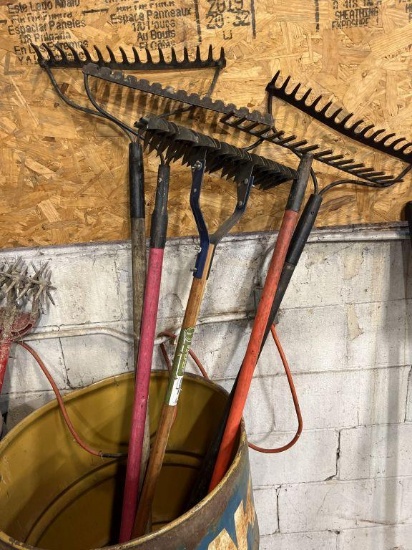 blue metal barrel...with commercial style landscaping rakes