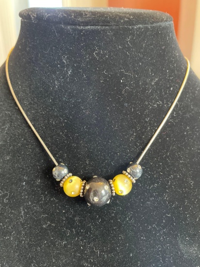 Sterling chain with yellow and black beads.