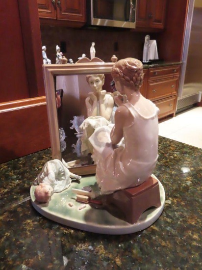 Lladro woman looking in mirror figurine