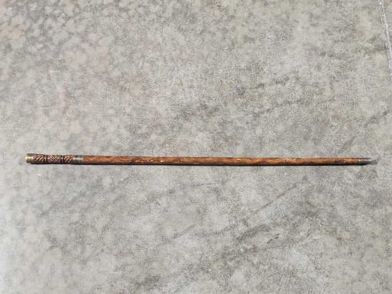 35 inch brass and wood Indian Head style cane with pull-out sword. has not been sharpened. sword has