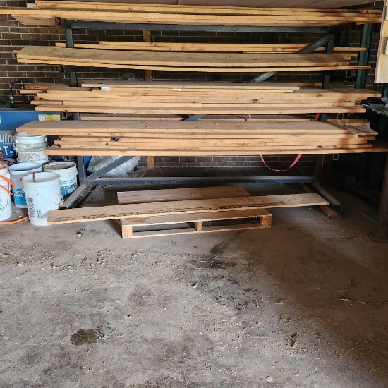 assorted...rough cut lumber. The longest piece is a little over 10 ft. Does not include metal rack.