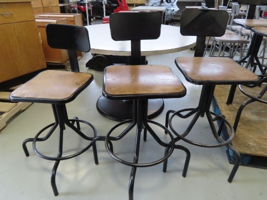 Lot of three industrial stools with black frames