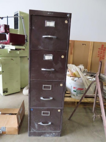 Metal four drawer filing cabinet. Has damage to top.