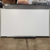 Smart Board with markers, Approximately 7 ft x 4 ft....Three of the markers are missing,
