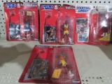 Lot of three Starting Lineup 1998 Edition figurine and card sets and Starting Lineup exclusive tops
