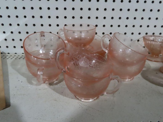Pink Depression glass cups and saucers