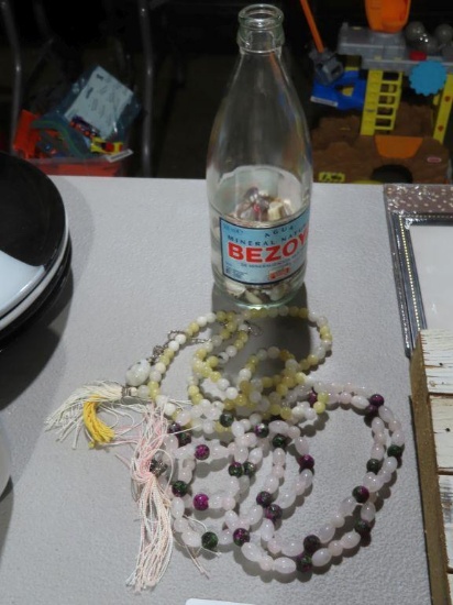 Costume jewelry necklaces and seashells