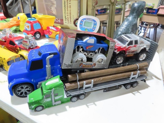 lot of two semi truck toys with monster trucks