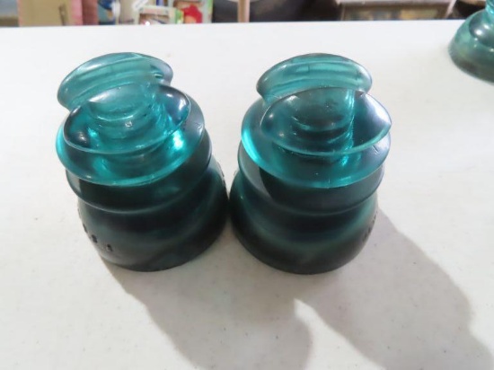 Antique blue glass insulators with wire groove on top