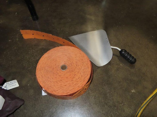 Grain ladle and roll of tickets