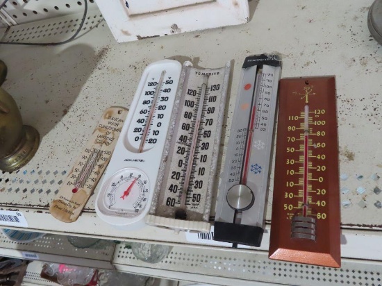 Variety of thermometers including Culligan water conditioning of Lawrence County advertising