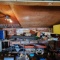 Approximately 12 ft metal framed workbench and contents.