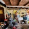 Lot of scrap items, tools, water skis and Etc along wall and in corner