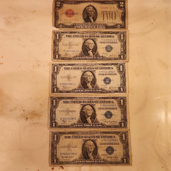 (4) One dollar...silver certificates and (1) Two dollar...bill