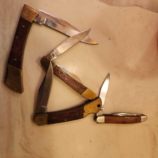 Lot of four wooden handled pocket knives, marked...China and Japan