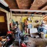 Lot of scrap items, tools, water skis and Etc along wall and in corner