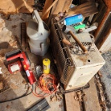 Electric 14-inch chainsaw, sandblaster parts, kerosene heater, jumper cables, and Etc