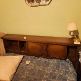 Vintage bedroom suite including full size bed, dresser with mirror, chest of drawers, and two