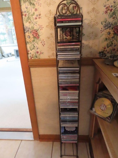 Metal CD rack with large assortment of CDs | Online Auctions | Proxibid