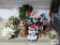 Santa Claus and snowman music boxes and other Christmas decorations and florals