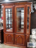 Two-piece curio cabinets with storage