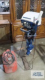 Evinrude fisherman 6 horsepower outboard boat motor with stand and gas tank