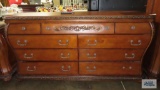 Cherry finish dresser with mirror by Ashley Furniture, matches lots 184, 198,... 200, and 201